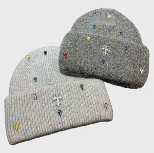 This new colorful rhinestone-embellished cashmere knit hat is soft, warm, windproof, and features ear flaps. Available in multiple colors, it's a stylish winter accessory for women.
