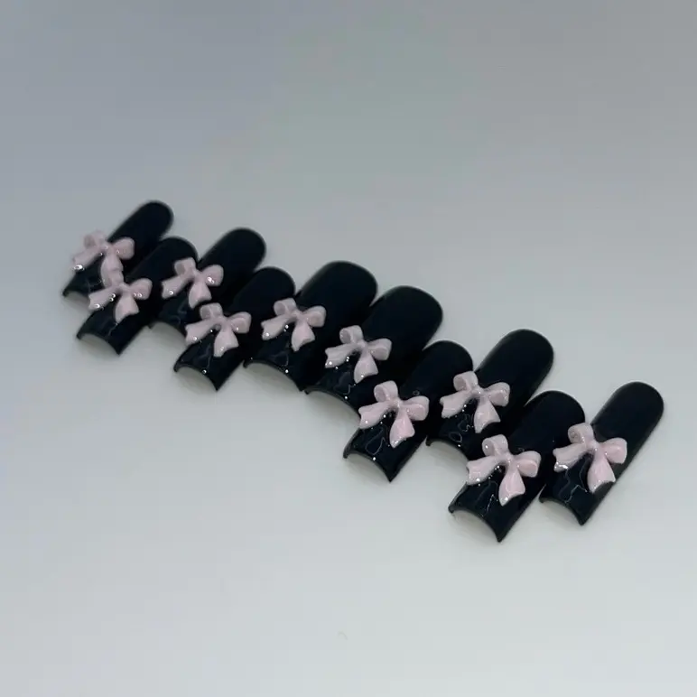 Cutesy pink bows on black press on nails Cutesy pink bows on black press on nails