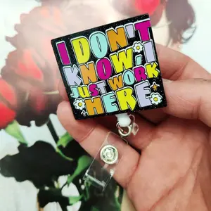 A work card telescopic buckle with text, the text adopts colorful style, with small flowers, stars and other decorations, equipped with telescopic structure and card clip, which can be used to hang work cards, Removable Cardholder