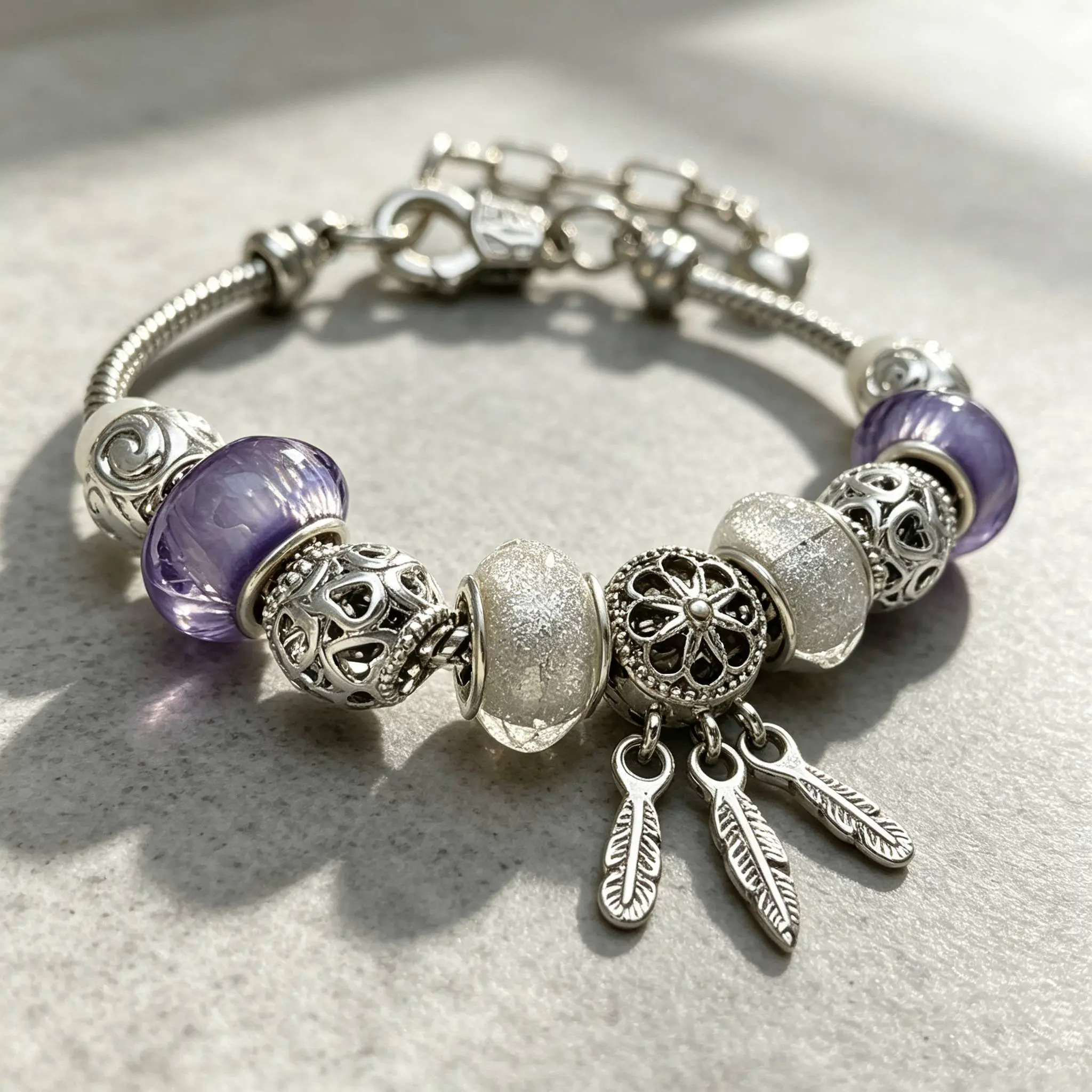 Elegant Purple Bead Bracelet with Silver Tone Charms and Feather Pendants for Women's Fashion Accessory