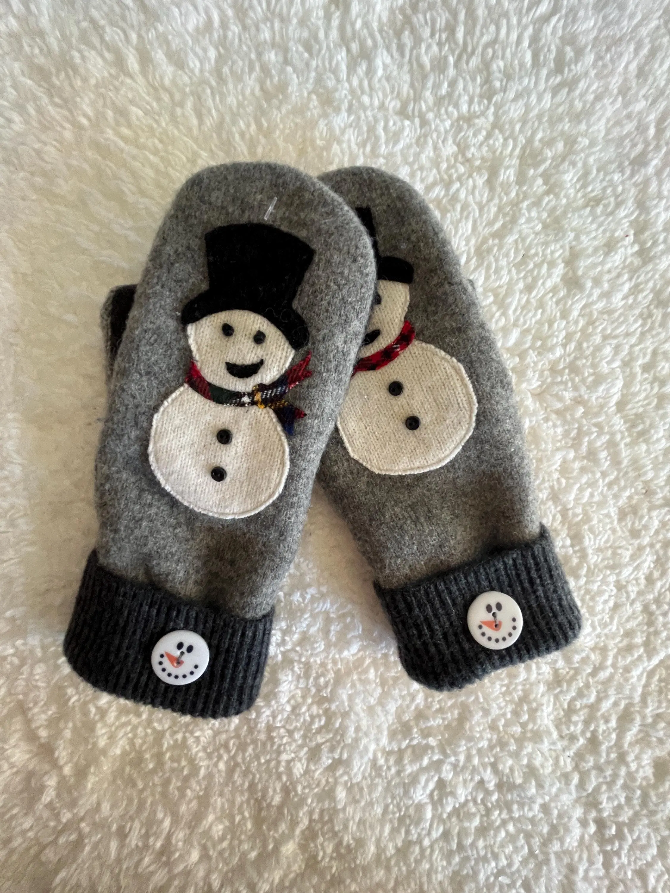 Snowman on wool mittens