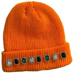 Orange Knitted Beanie Hat with Decorative Gems highlighting head piece