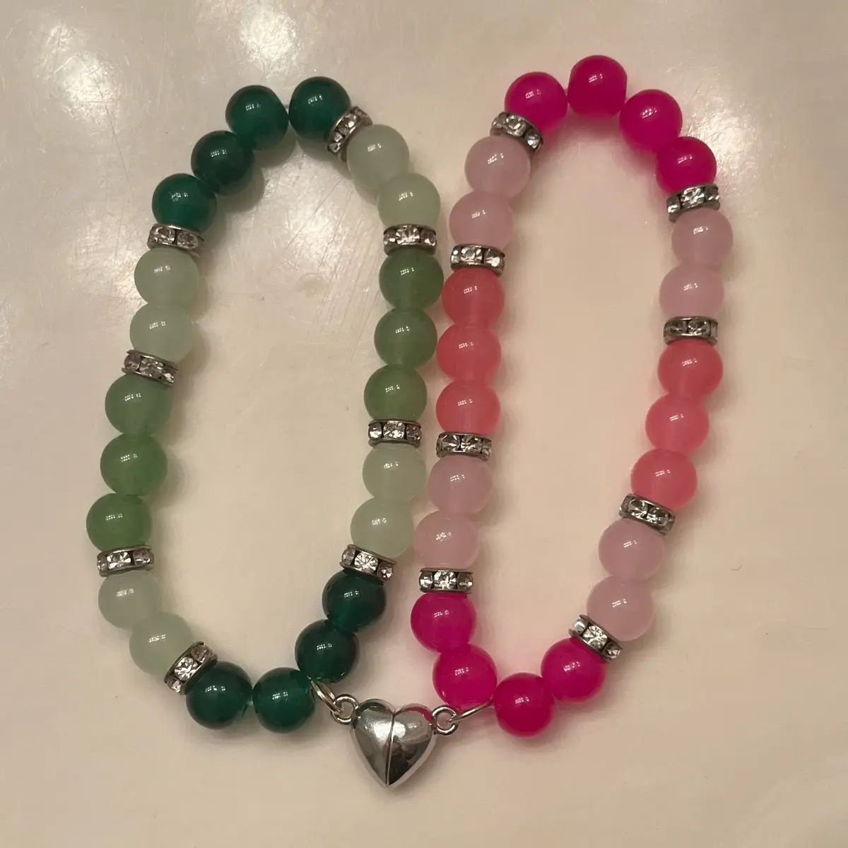 Set of 2 Friendship/lover bracelets with half a heart magnet on each.