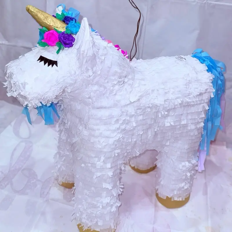 Piñata Unicorn Design with Floral Accents and Blue Tassels for Festive Celebrations