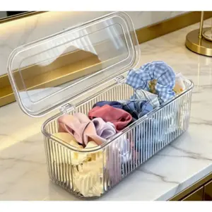 Striped transparent flip-top storage box, which can be stacked for storage. It can store beauty sponges, makeup brushes, hairpins, hair ropes, and hair clips. Suitable for bedrooms, bathrooms, and washstands.