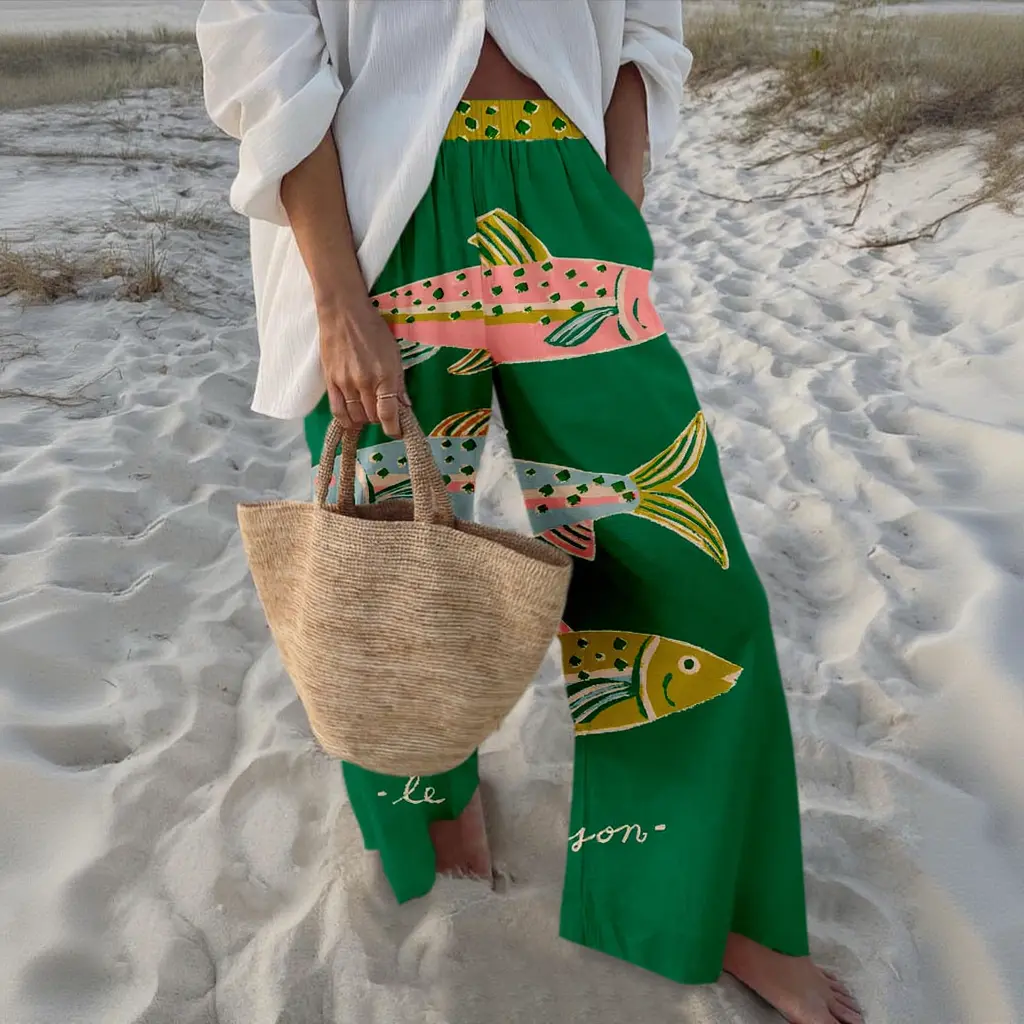 High-waisted wide-leg pants with colorful abstract fish print. Lightweight and flowy material, high-waisted loose fit, for a relaxed beach vibe. Sizes S-5XL