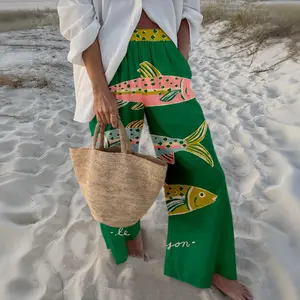 High-waisted wide-leg pants with colorful abstract fish print. Lightweight and flowy material, high-waisted loose fit, for a relaxed beach vibe. Sizes S-5XL