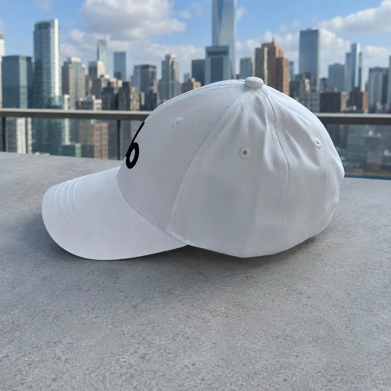 A Yoga Performance Off-Duty District Trucker Hat - Black Baseball Cap with White Letter Design, 100% Polyester, Sun Protection, Durable Woven, Minimalist Outdoor Headwear for Running & Activities
