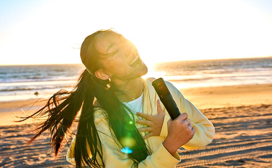 JBL PartyBox On-the-Go 2 Plus, Portable party speaker with real-time AI vocal removal, a wireless mic, powerful JBL Pro Sound, a dynamic lightshow, up to 15 hours of playtime, and a replaceable battery, plus a handle and shoulder strap