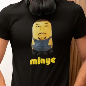 Here is the English translation of the revised version:  "The hilarious 'Minye' t-shirt will bring laughs and turn heads – a unique blend of playful cartoon style and celebrity vibe. Fun, bold, and full of personality!" penny tees shirt loose funny tshirt