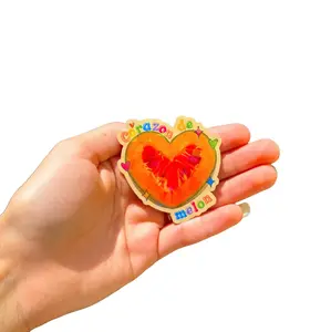 Corazón De Melon Vinyl Sticker - Heart-Shaped Design with Colorful Text and Melon Theme