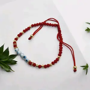blue eye beads,red string , red and gold stone beads, adjustable bracelet