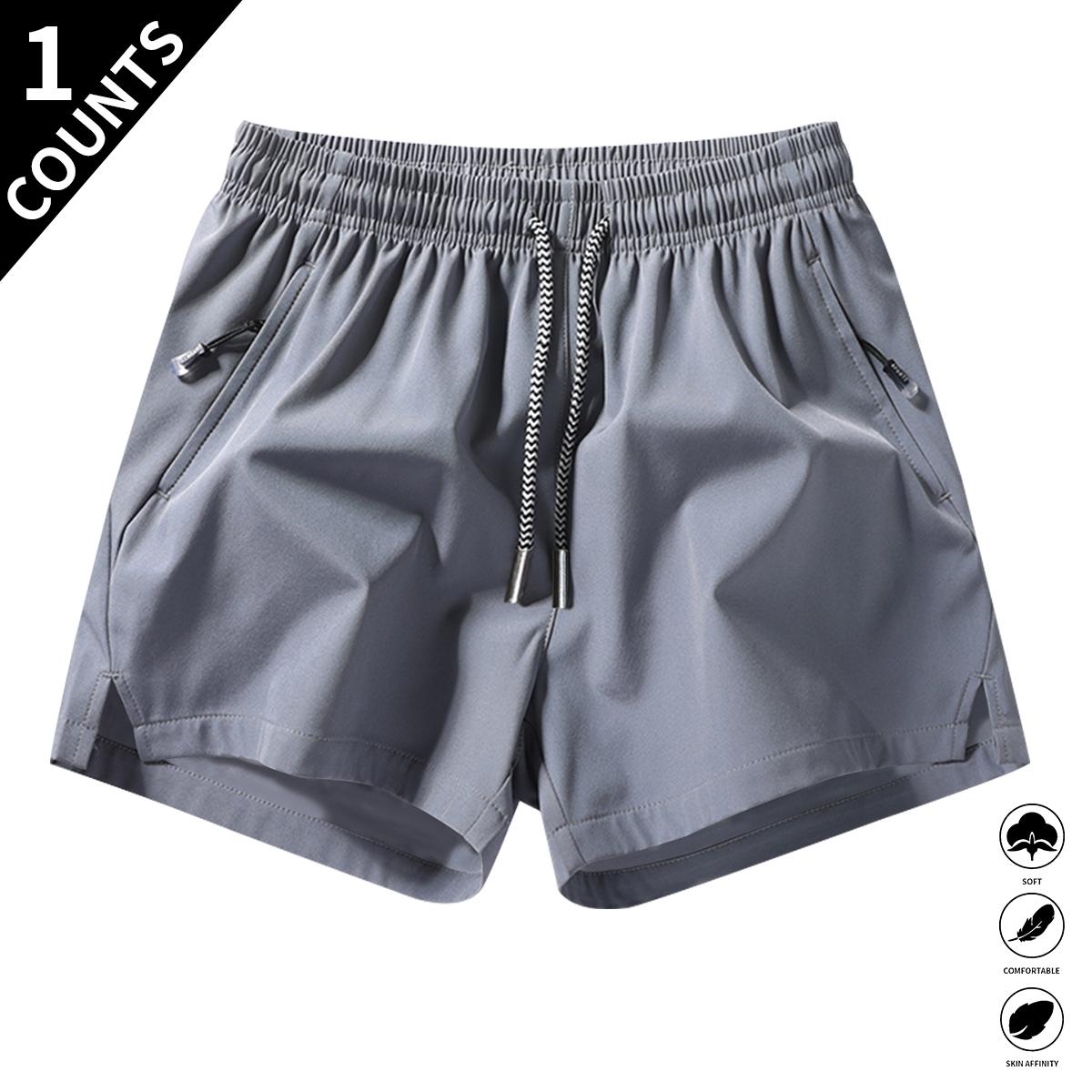 Men’s solid-color casual shorts with zippered pockets—fashionable summer drawstring athletic shorts suitable for gym workouts and outdoor wear. Men’s solid-color casual shorts with zippered pockets—fashionable summer drawstring athletic shorts suitable fo