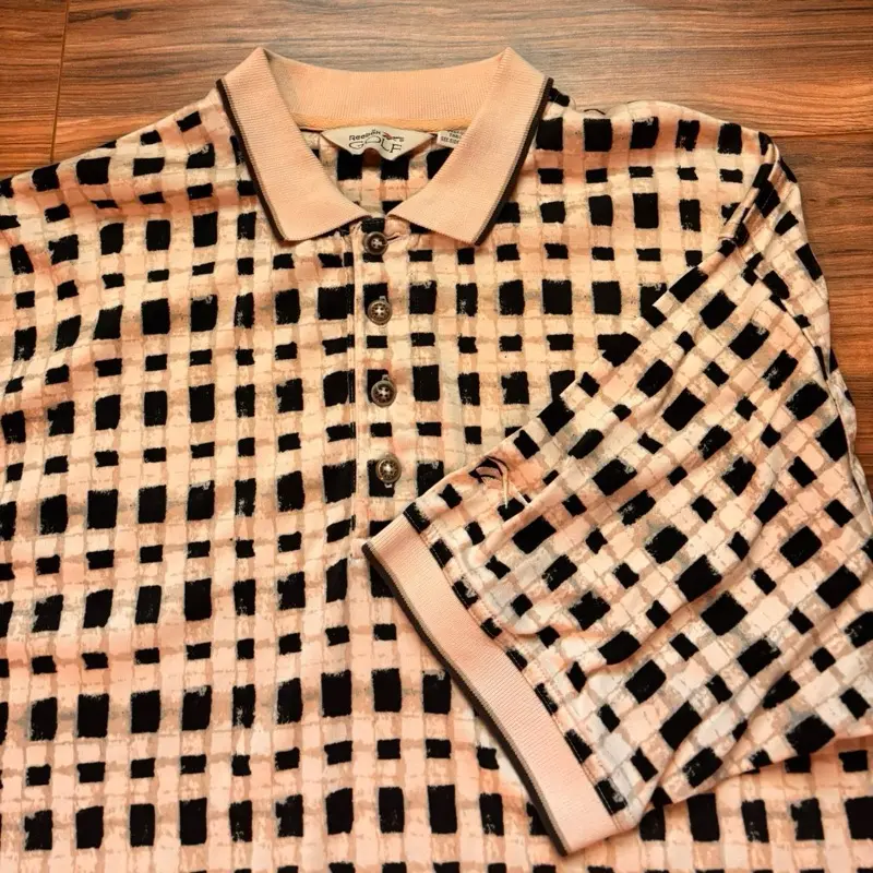 Reebok Polo Shirt in Mint Condition with Waffled Pattern and Classic Collar Design