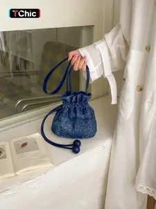 Vintage vintage denim flash diamond crossbody bag with drawstring drawstring and bucket bag, shoulder bag made of vintage denim fabric and flash diamond design, drawstring drawstring and adjustable shoulder strap, suitable for daily commuting, short dista