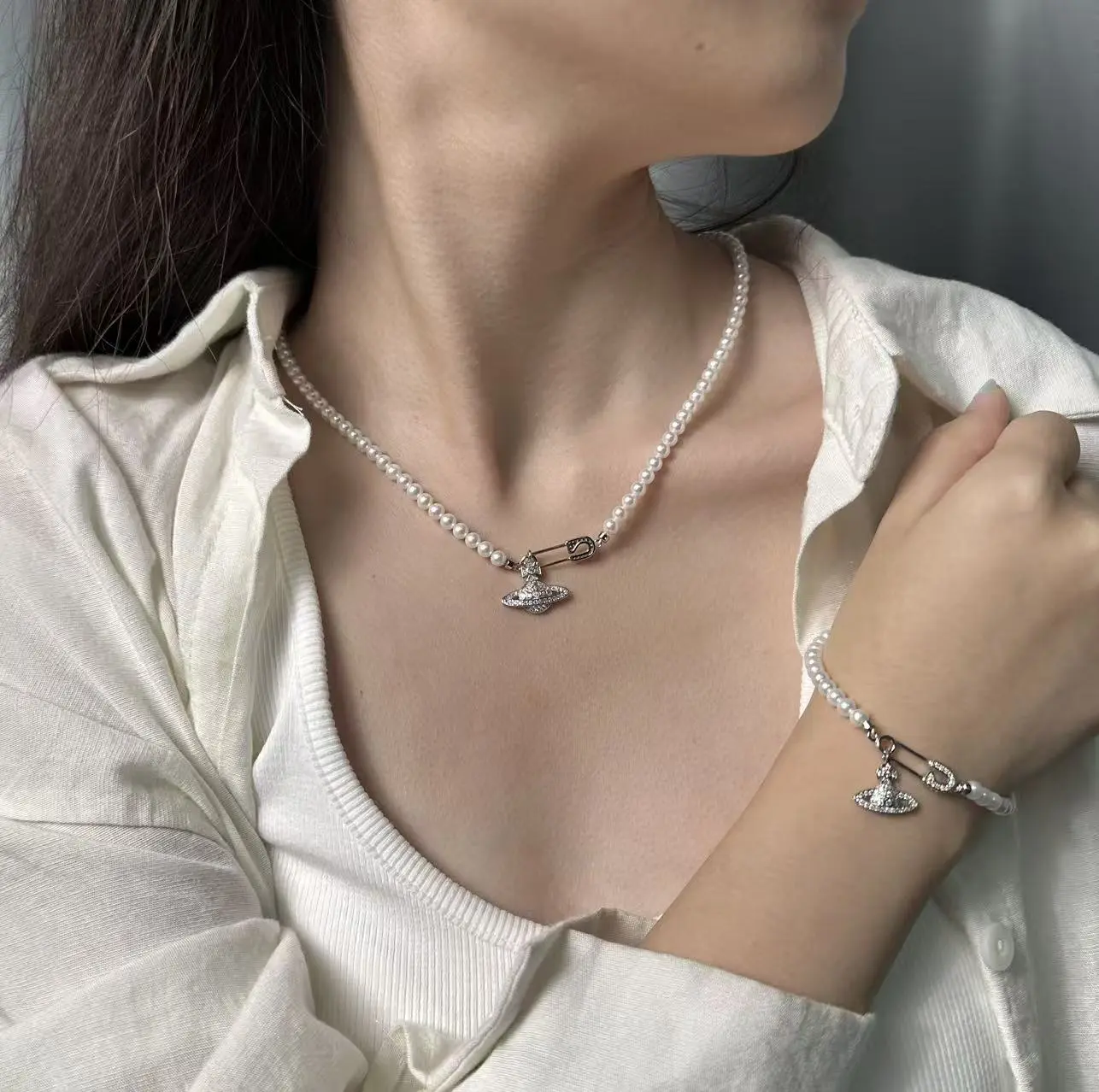 NC067-The ‘Sovereign Pin’ Bracelet & Necklace — A Freshwater Pearl Strand with a Signature Celestial Orb Charm. pearl bracelet & Necklace, safety pin bracelet, orb charm bracelet, planet charm bracelet, freshwater pearls, punk pearl jewelry, edgy jewelry