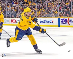 Filip Forsberg Nashville Predators Unsigned Gold Jersey Shooting Photograph