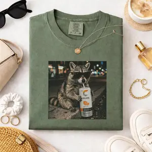 Comfort Colors Cool Raccoon Drinks Celsius Orange Flavor Graphic Unisex Tee, Funny Soda Lovers Shirt, Vintage Raccoon Meme Gifts