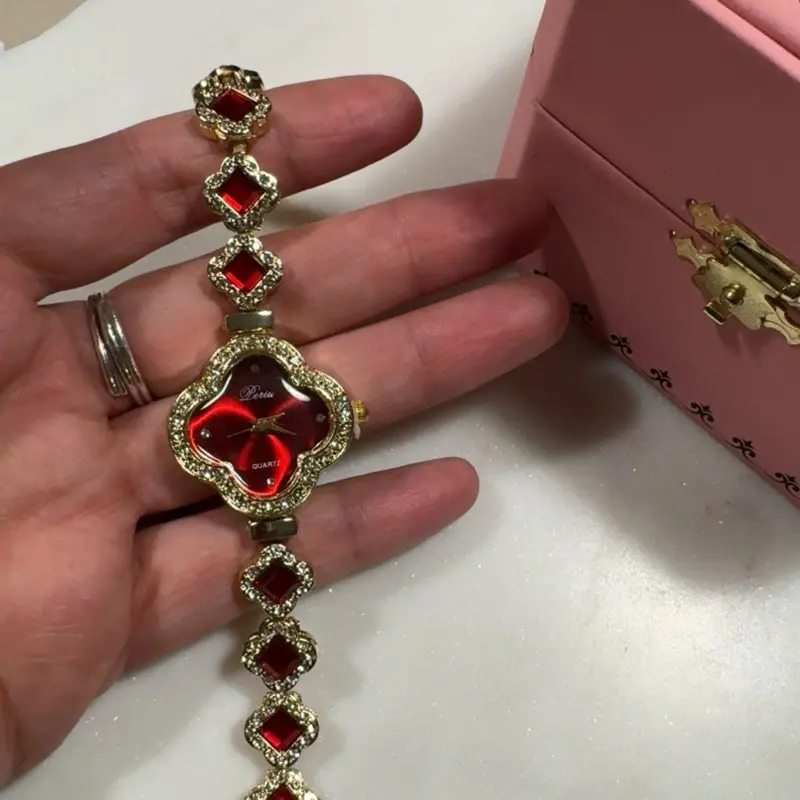 Gold Plated Clover Watch with Red Gemstone Accents and Elegant Design