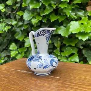 Delft Style Ceramic Pitcher with Peacock and Floral Motifs