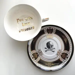 Porcelain "You have been poisoned" cup and saucer set. 22k gold, food safe.