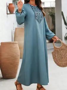 A women's solid color long dress, Tunic dress, Bohemian casual dress, with black ethnic-style embroidery and loose lantern sleeves, featuring a casual and retro style, suitable for relaxed yet stylish occasions such as daily shopping, vacation strolling