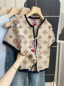 Women's khaki bohemian vacation short-sleeve knit top Boho Tie Top. Loose round neck, contrast geometric print, front tie and contrast piping. Comfortable and stylish for spring & summer casual wear.
