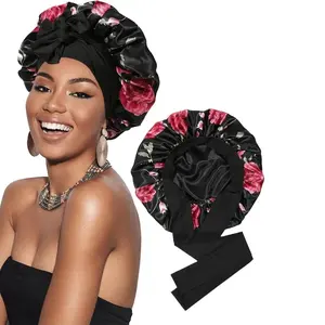 Double-layer satin bonnet with an adjustable tie, designed to protect curly, natural, or relaxed hair while sleeping. The smooth satin fabric reduces frizz, tangles, and breakage, preserving hairstyles overnight.