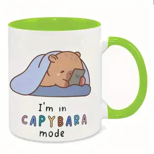 2026  1pc Cute Capybara Ceramic Mug 11oz - "I'm in Capybara Mode" Design, White with Green Handle & Rim, Fun Gift for Coffee & Juice Lovers, Hand Wash Only, Novelty Drinkware| Playful Mug Design| Durable Coffee Cup, Coffee Bar Accessories