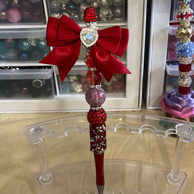 Beautiful Red Bow on a Red Extended Pen