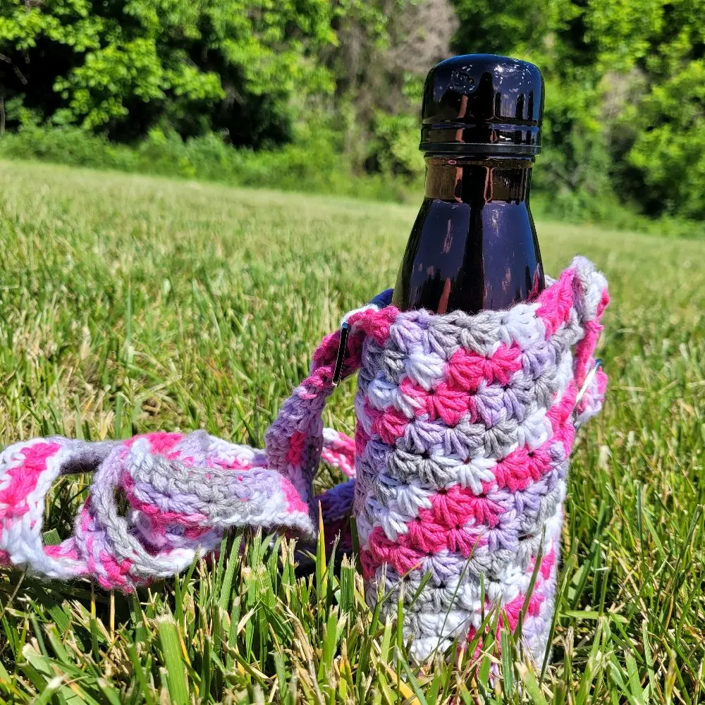 Crochet Star Stitch Water Bottle Holder fit for outside use. Stay hydrated on hikes, the beach, and even in the office or at home