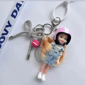 Handmade Vintage Pink Helmet Doll Bag Charm with Silver Bow Pendant and Tennis Racket Accessory – Cute Y2K Cyberpunk Style Keychain for Girls, Aesthetic Backpack Decoration, Edgy Streetwear Vibe, Trendy Retro Fashion Statement, Ideal Gift for Teen Girls