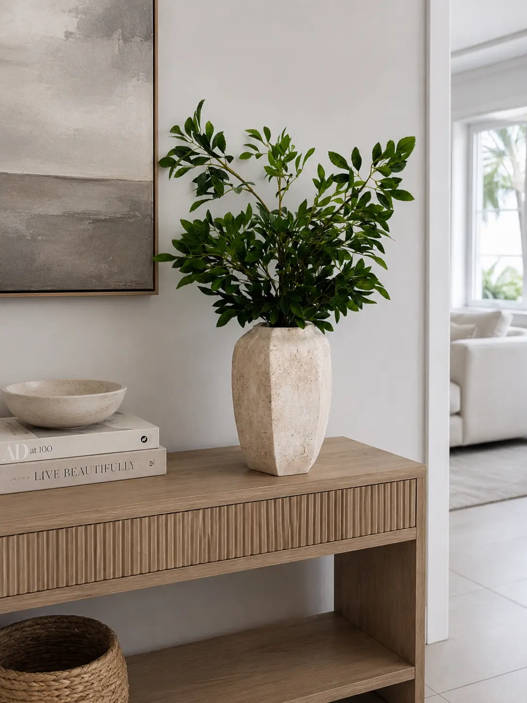 GREEN FOLIAGE ARRANGEMENT IN TEXTURED STONE VASE