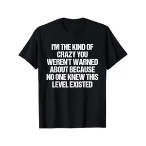 Funny slogan T-shirt “I’m the kind of crazy you weren’t warned about” — black with white text print; casual crew neck short-sleeve shirt; comfortable casual wear and statement tee for year-round humor apparel; plus size