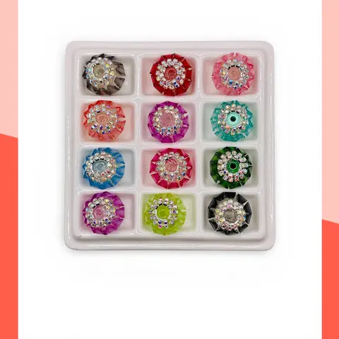 Elegant Fancy Bead Collection featuring sparkling rhinestones, bold colors, and meticulous craftsmanship. This mix includes both small and large beads, perfect for creating beaded pens, keychains, and a wide variety of beadable projects.