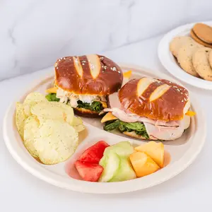 Karat Earth 10'' PFAS Free Compostable Bagasse Round Plates, Natural, 3 Compartments - 500 pcs