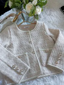 Pink tweed jacket with gold button