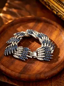 A luxurious silver tone bracelet with wing design, featuring exquisite layered feather shapes and sparkling gemstones, presenting an elegant and sophisticated look, suitable for wearing on grand occasions such as dinners and formal parties.