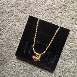 Gold Twisted Rope Necklace with Intricate Fleur-de-Lis Pendant - Elegant Jewelry for Everyday Wear