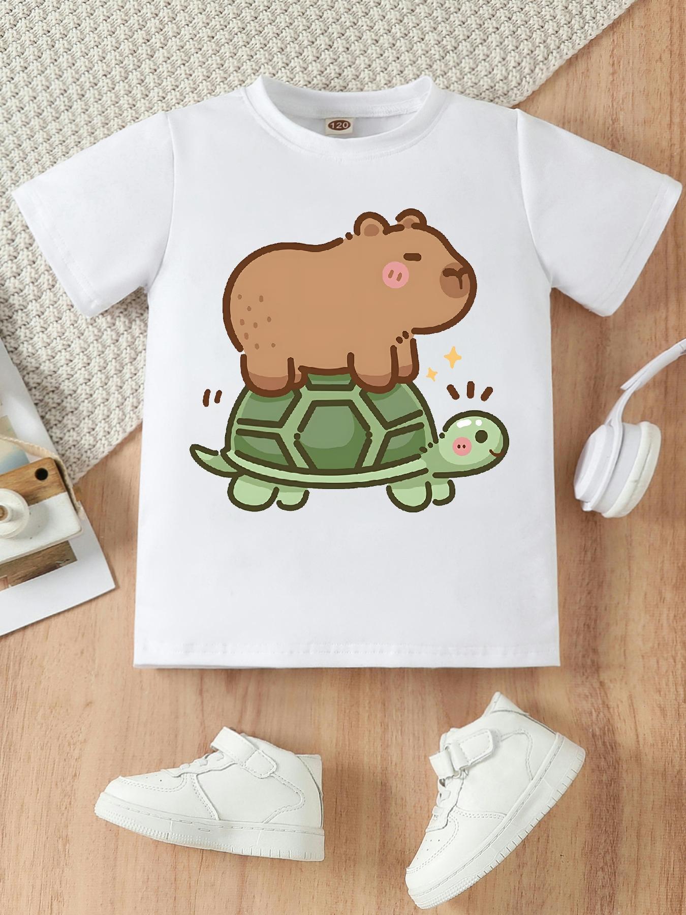 1Girls' T-shirt with Funny Cartoon of Kapi Riding a Turtle | Casual Knit Top, Crew Neck, Regular Fit, Medium Stretch Fabric, Perfect Gift for Little Ones, All-Season Wear 1Girls' T-shirt with Funny Cartoon of Kapi Riding a Turtle | Casual Knit Top, Crew Neck, Regular Fit, Medium Stretch Fabric, Perfect Gift for Little Ones, All-Season Wear