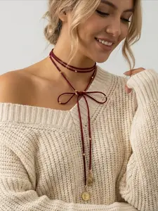 Fashionable and creative Hepburn style long red human figure coin pendant necklace, French retro bow necklace