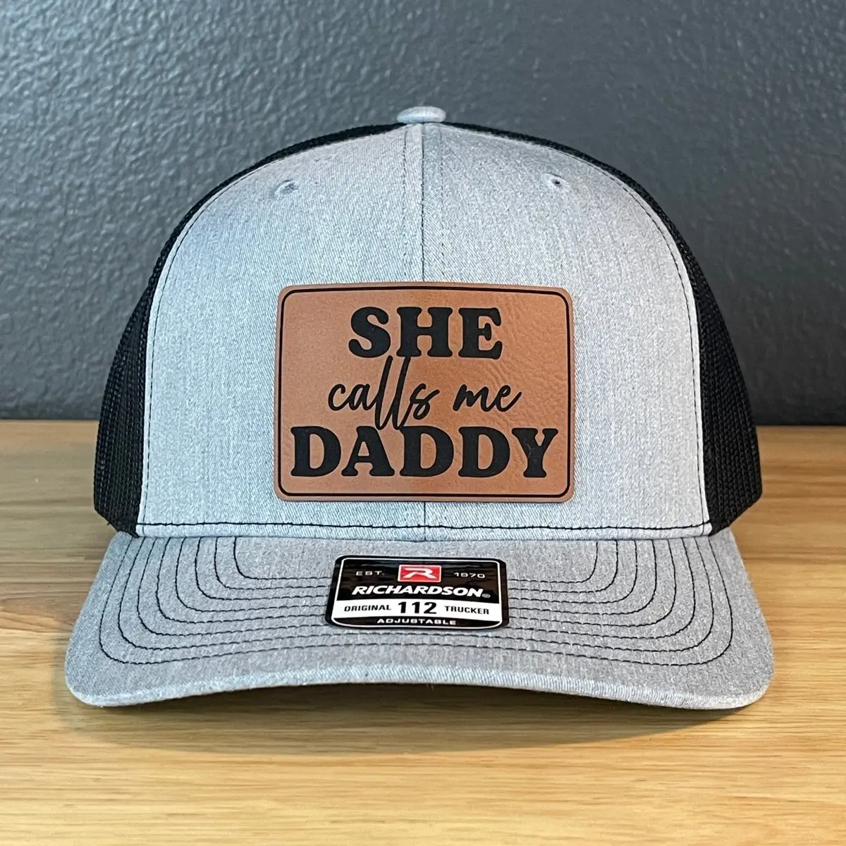 She Calls Me Daddy Funny Leather Patch Hat Heather Grey/Black Adjustable Trucker Hat Adjustable Cotton Snapback