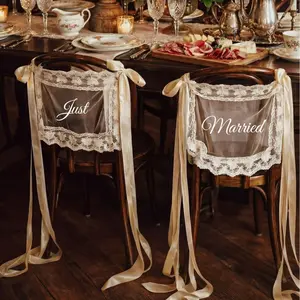 Newlywed Wedding Chair Back Fabric Decorations — A Romantic Two-Piece Set, featuring exquisite lace and flowing ribbon ties—the perfect choice for adorning the backs of your wedding reception chairs.（Available in a variety of colors）
