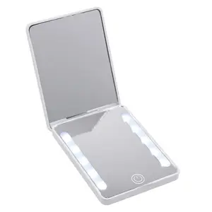 Ultra-slim portable LED makeup mirror with dual-color lighting, 3 modes, stepless dimming, and a 2x magnifying side — foldable for travel touch-ups, a perfect creative gift for her.
