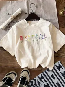 Retro Rainbow Wildflower Botanical Graphic T-Shirt, Vintage Boho Colorful Floral Print Oversized Crew Neck Tee, Women's Short Sleeve Streetwear Cotton Top, Trendy Cottagecore Aesthetic Shirt for Plant Lovers, Nature Enthusiasts and Casual Outfit Fans