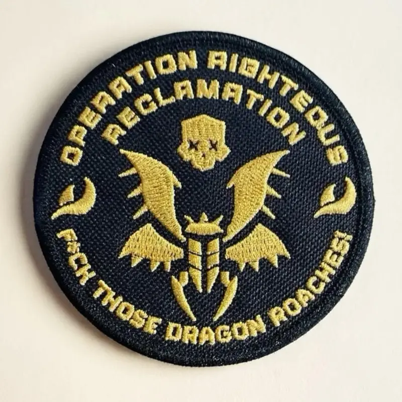 Helldivers 2 Operation Righteous Reclamation Durable Iron-On Embroidered Tactical Badge, 3.76in Black Fabric Patch with Bold Gold Stitching & Dragon Roach Motif, Embroidery Gear Accessory for Gamers’ Jackets-Vests
