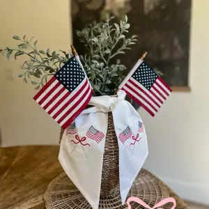 Patriotic linen wreath sash with machine embroidered American flags + bows.