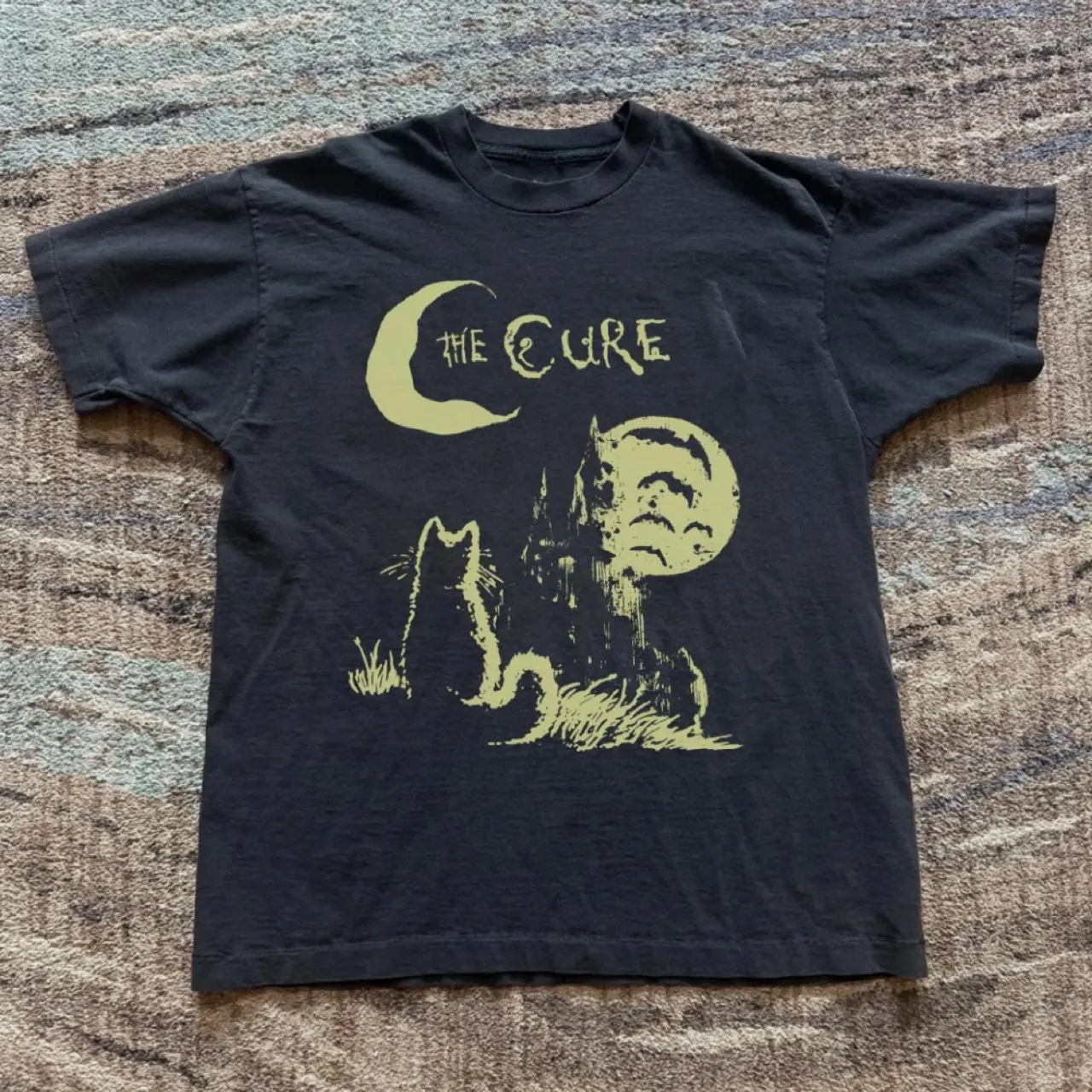 The Cure band tee with yellow graphic of a cat under a crescent moon with the words 'THE CURE' T-shirt Cotton Fabric Top