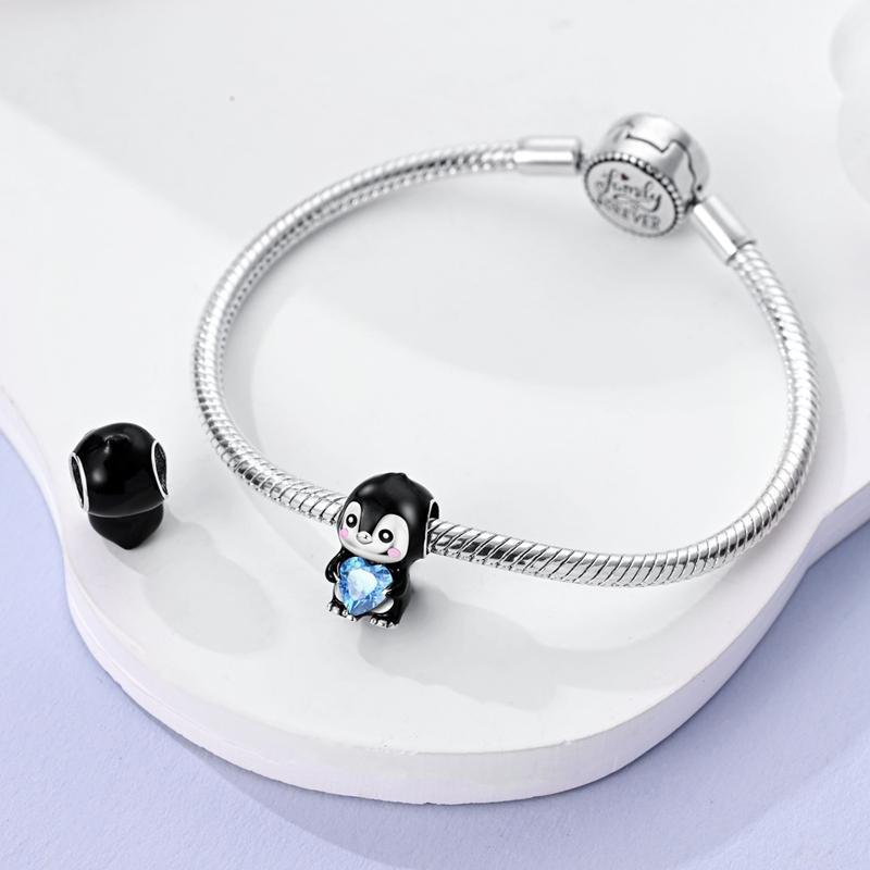 MULA cute penguin holding a heart-shaped pendant, 925 silver-plated inlaid with blue zircon and enamel - can be used with Pandora bracelets and necklaces, a perfect gift for women, girls, children