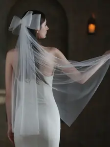 Mid-length flowing bridal veil with elastic mesh, large bow, and rhinestone embellishments